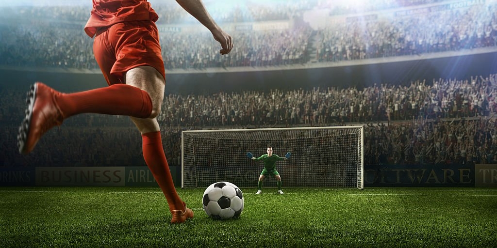 Footballers Community | player ready to hit the football to make a goal